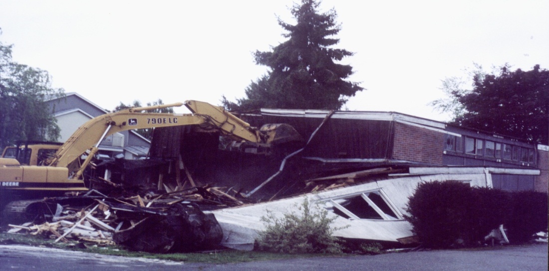 A 2002 photograph showing the demolition of the original 1955 parish hall in Richmond, BC to make way for a new 18,300 square foot multiuse facility.